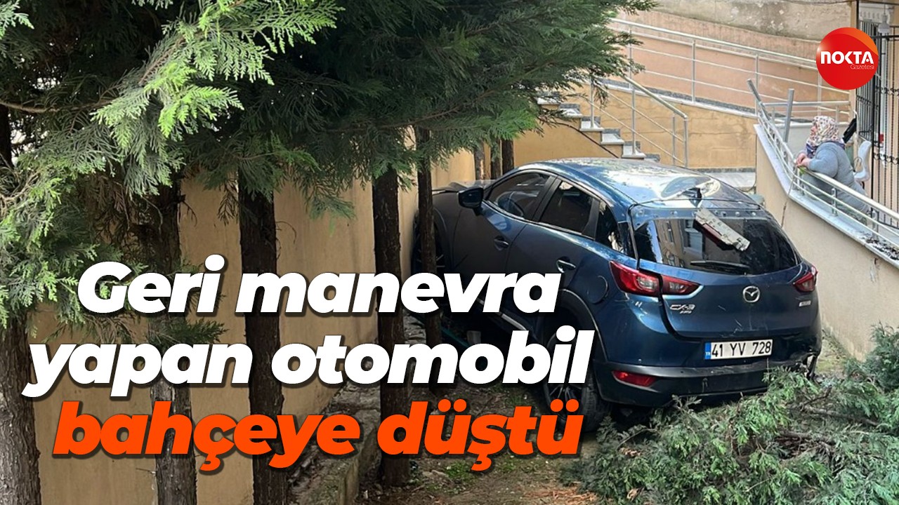 Geri manevra yapan otomobil bahçeye düştü