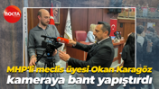 MHP'li meclis üyesi Okan Karagöz kameraya bant yapıştırdı