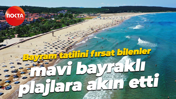 Bayram tatilini fırsat bilenler, mavi bayraklı plajlara akın etti
