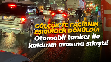 Gölcük’te facianın eşiğinden dönüldü: Otomobil tanker ile kaldırım arasına sıkıştı!