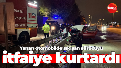 Yanan otomobilde sıkışan sürücüyü itfaiye kurtardı!