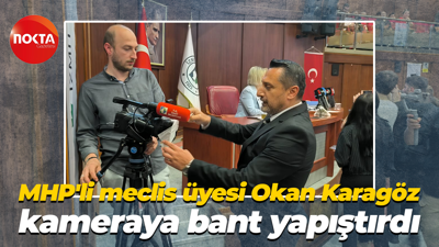 MHP'li meclis üyesi Okan Karagöz kameraya bant yapıştırdı