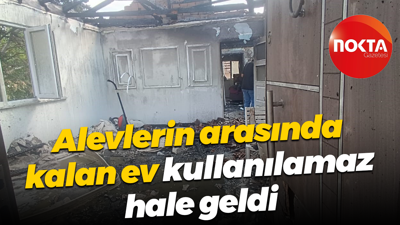 Alevlerin arasında kalan ev kullanılamaz hale geldi